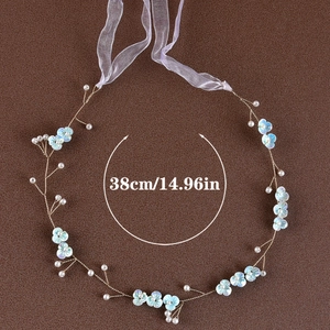 Detail view of 38cm bridal headband with blue silk flowers and white pearls