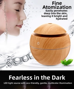 Macro detail of wooden grain spherical humidifier with LED light ring and mist outlet