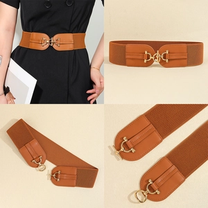 Detail showing brown elastic corset belt with gold metal buckle and PU leather patches