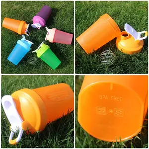 Five-color sports protein shaker bottle with mixing ball and scale marks shown in grid view