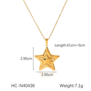 Detailed view of gold star pendant necklace with 2.95cm dimensions and 41+5cm chain length