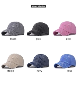 Color palette display showing six distressed washed baseball caps with Kindness embroidery