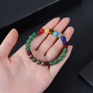 Colorful natural stone beaded bracelet with amethyst and tiger eye on hand