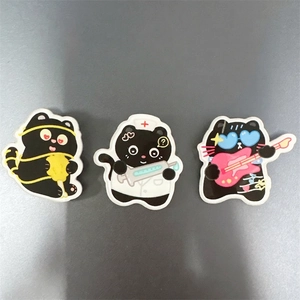 Three cute black cartoon acrylic cat brooches featuring nurse and guitar themes