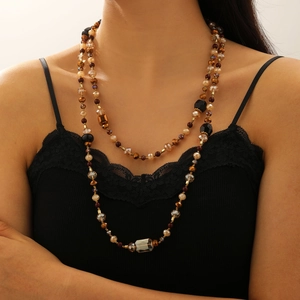 Bohemian multilayer crystal beaded necklace with grey gemstone pendant on model