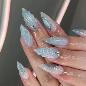 3D ocean shell nail tips with ice blue gradient, 3D relief texture and silver glitter
