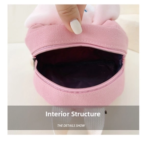 Detailed view of the internal structure of children pink rabbit backpack with metal zipper