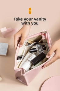 Pink PU leather makeup bag detail showing interior mesh pockets and skincare storage
