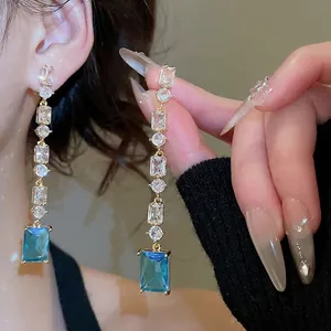 Gold-plated drop earrings with clear zircons and a stunning aquamarine rectangular stone