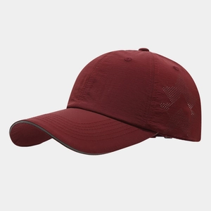 Burgundy quick-dry nylon baseball cap with laser-cut star vents and reflective brim trim