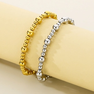 Bracelets à billes polies en or 18 carats et argent au design minimaliste