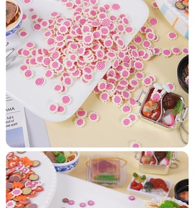 Detailed view of miniature resin fish cake slices and mini bento food props for DIY crafts