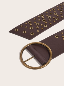 Detail of brown PU leather belt with vintage bronze round buckle and metal rivets