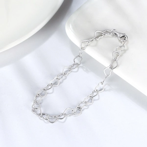 Detailed macro view of S925 sterling silver heart bracelet with Italy hallmark