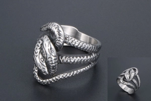 Detailed view of the double-headed snake ring with intricate metallic scales in punk style