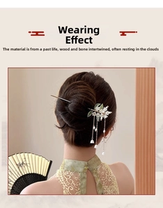 Detail view of Lily of the Valley hair stick with pearl tassels on traditional outfit