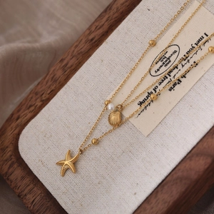 Three-layer titanium steel starfish shell necklace with pearls in 18K gold plated finish