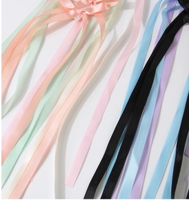 Detailed macro view of colorful satin ribbons for handmade bow hair clips accessories