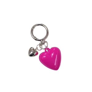 Pink and silver resin heart keychain with metallic ring on a plain white background