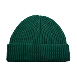 Detailed view of dark green ribbed knit texture on a warm winter beanie hat