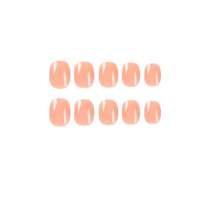 Short round nude pink press-on nails set with glossy finish on a clean white background