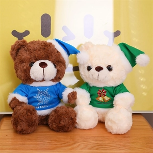 Brown and beige Christmas teddy bears in festive blue and green holiday outfits