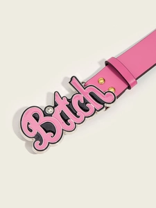 Detail of pink leather studded belt featuring a large metal Bitch buckle with rhinestone