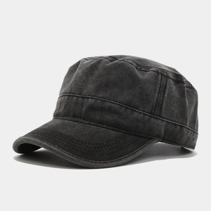 Detail of washed charcoal grey flat top army cap with retro stitching and vintage texture