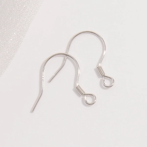 Close-up of a pair of silver S925 sterling silver earring hooks for DIY jewelry making