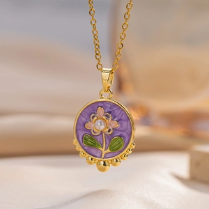 Golden flower necklace with purple enamel pendant, pink petals and a pearl center