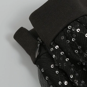 Detail of high-quality invisible metal zipper on black sequin mesh sheer dress