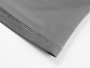 Close-up of high-elasticity grey tube top showing neat double-needle hem stitching
