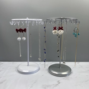 Rotating iron jewelry display stand for necklaces and earrings in white and silver metal