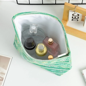 Large capacity green woven tweed makeup bag with silver zipper and spacious white lining
