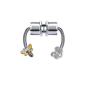 Detail of silver magnetic nose ring featuring bee and honeycomb charms with crystals
