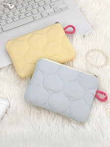 Yellow and light blue quilted zippered storage pouch for cosmetics and small items