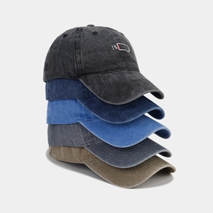 Detail of five washed cotton baseball caps with 1% low battery embroidery and vintage texture