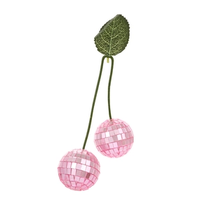 Close-up of pink disco ball cherry ornament with reflective mirror tiles and green leaf