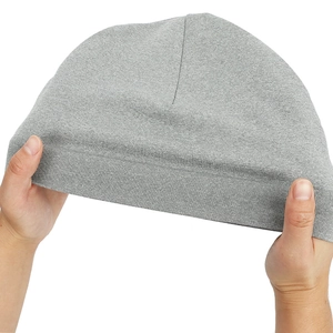 Close-up of light grey knitted sports hat showing superior elasticity and ribbed texture