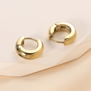 Macro shot of 14K gold plated stainless steel chunky C-shaped hoop earrings