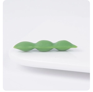 Detailed macro view of realistic green PVC soybean pod with three beans and matte texture