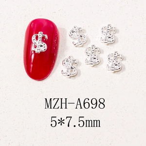 Detailed view of silver dollar sign nail charms showing 5x7.5mm size and application