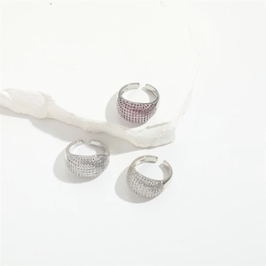 Adjustable silver rings set with white and magenta pavé zircon crystals on stone