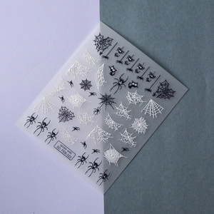 5D embossed Halloween nail stickers featuring realistic black spiders and white spider webs