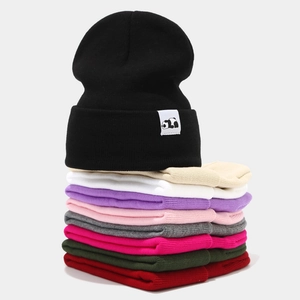 Winter knitted beanie hats in nine colors with panda patch and cuffed design for warmth