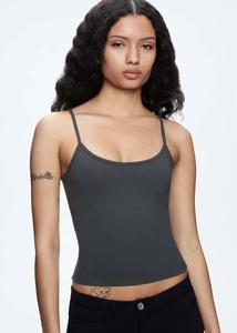 Detail view of charcoal grey slim-fit tank top with thin straps and elastic fabric texture