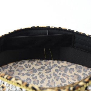 Macro detail of leopard print captain hat showing inner elastic sweatband and gold trim