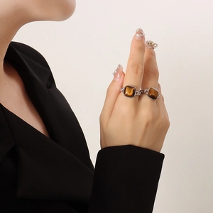 Vintage square tiger eye stone ring with silver chain link band worn by model