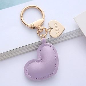 Purple leather heart keychain with gold-plated ring and engraved love metal tag