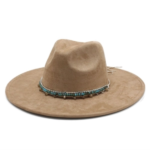 Detail of camel suede fedora with ethnic beaded band and leather tassel side fringe